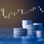 Stack of money coin with trading graph, financial investment con